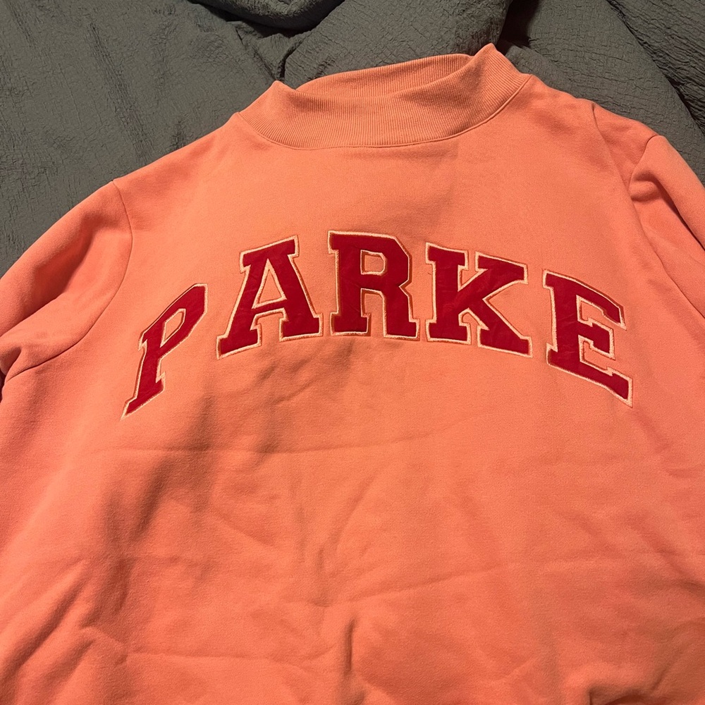 Coral Sweatshirt with Red Lettering